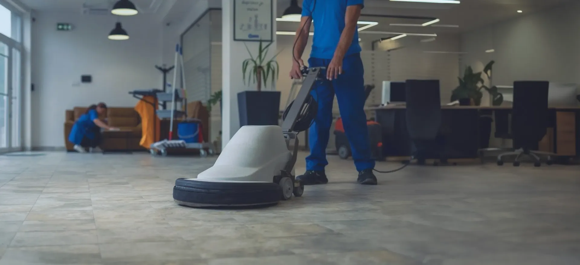 Millers cleaning team working in a bright commercial space